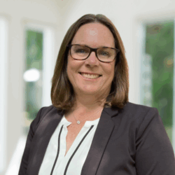 Smiling woman with glasses in a professional outfit Smiling woman with glasses in a professional outfit