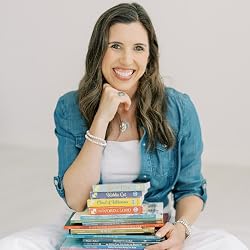 Potrait of author Katie Warner with some of her books Potrait of author Katie Warner with some of her books